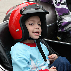 Star Tristan gives a big smile to the crowd before the San Antonio Ride for Kids.